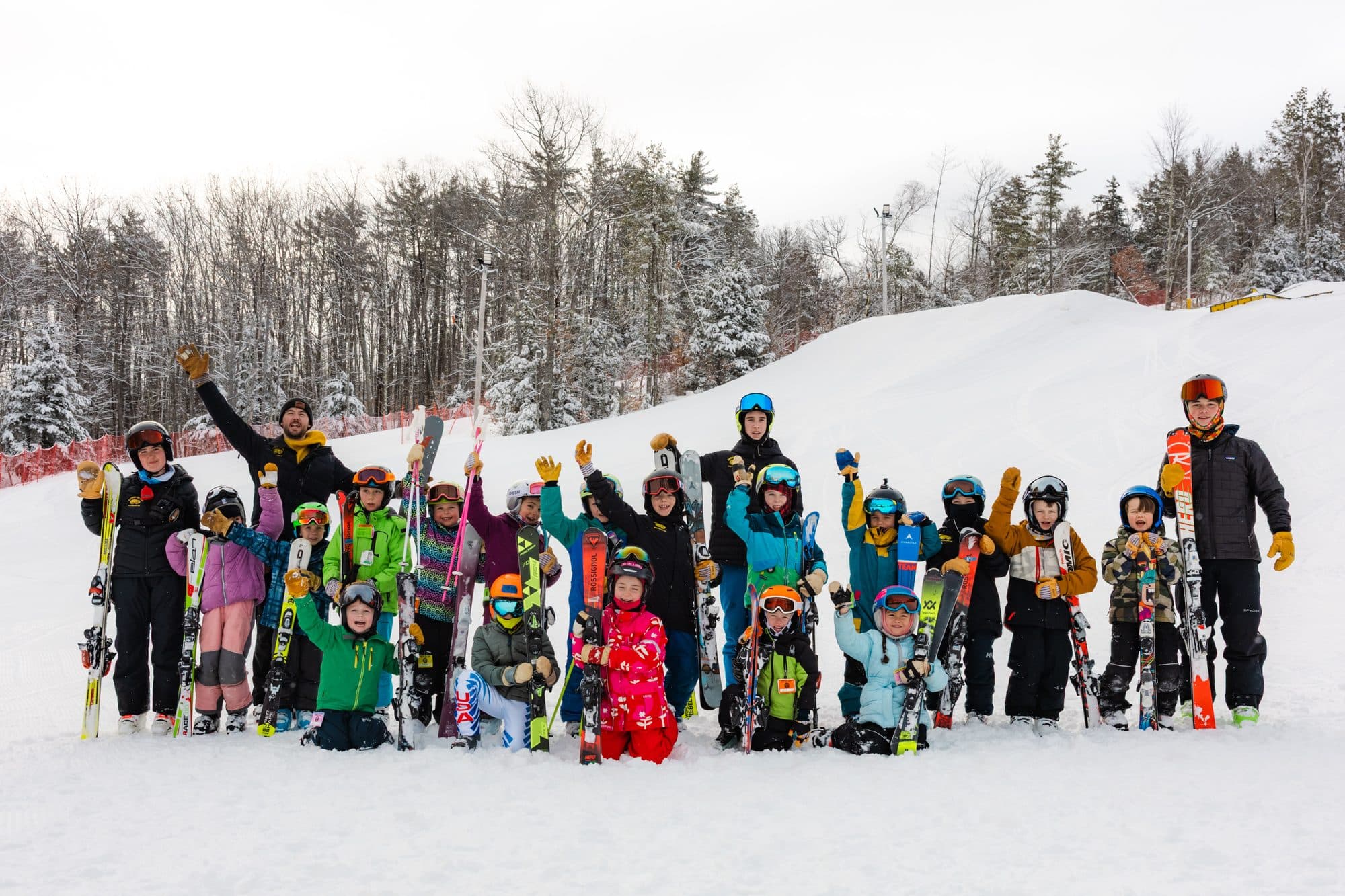 The U8 group and their coaches on the slope at Abenaki